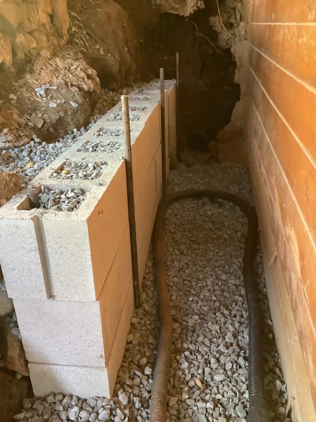 Drain rock and block we backfilled against a foundation wall