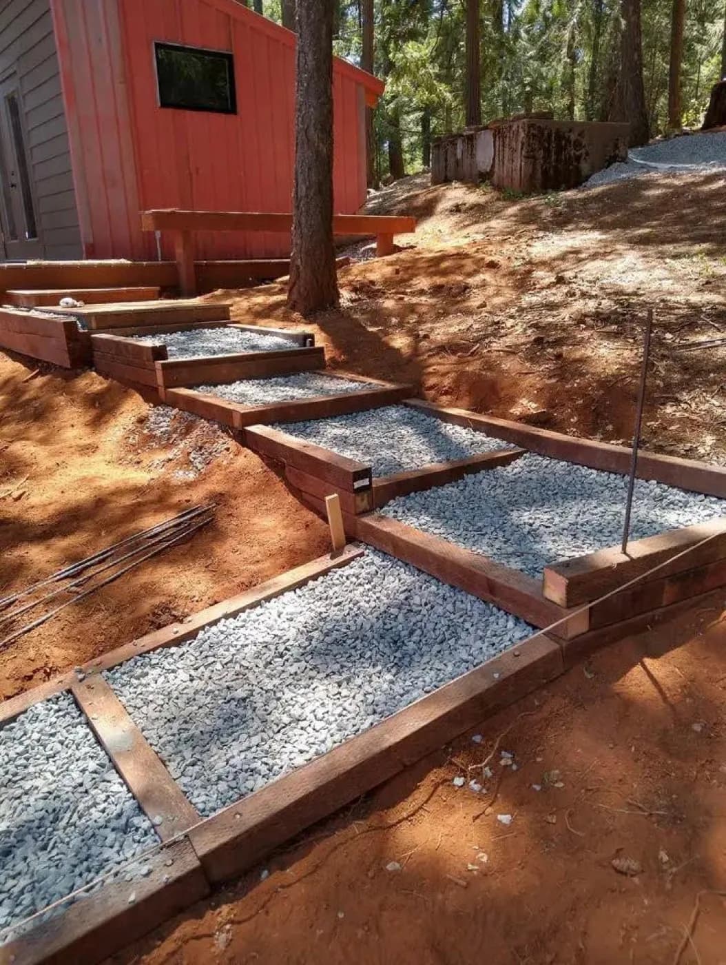 Gravel steps we framed with timber risers up a cut slope