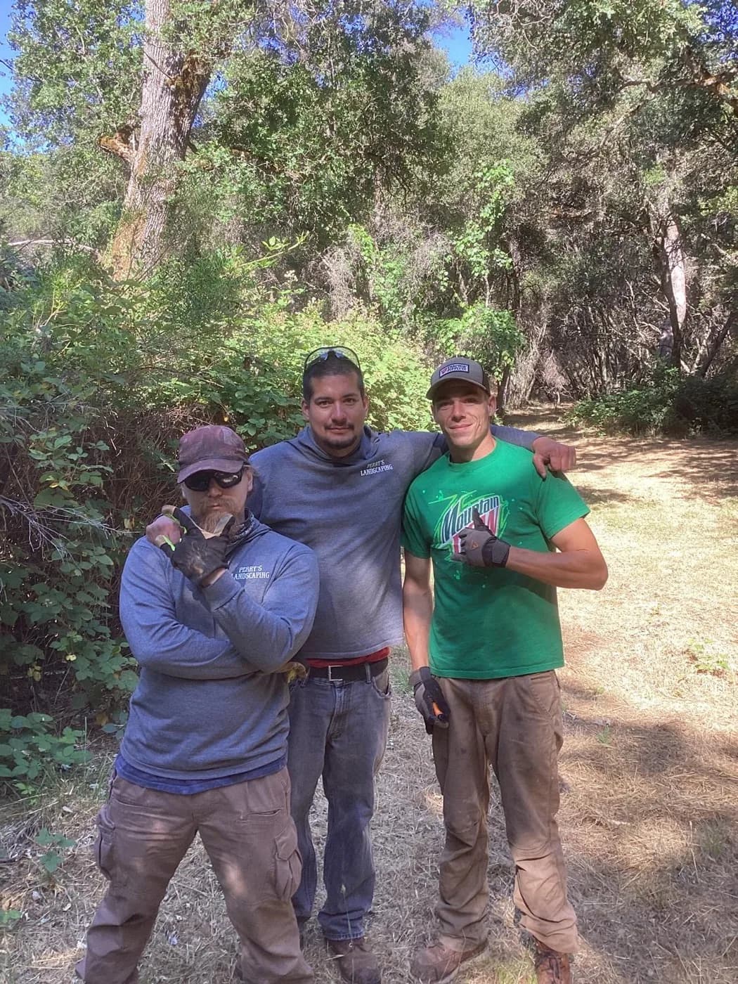 Three-man Perry's Landscaping crew on site at the end of a job