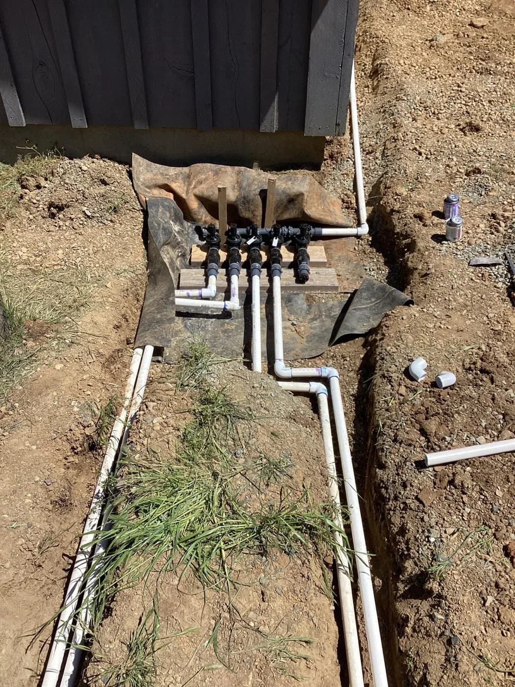 Sprinkler valve manifold we set into a trench before backfilling